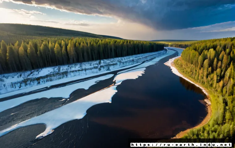 Home 17 지구과학과 지구 온도 변화 - Photorealistic split-season landscape in central Russia, a melting snowfield and thawing river in th...